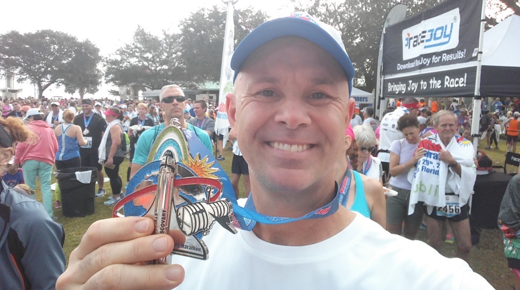 Space Coast half marathon and full marathon takes place at Cocoa Village. Eric Larkin is pictured holding the race medal